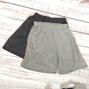 Pair of Reebok Athletic Shorts one Gray with Orange Trim and one charcoal grey L